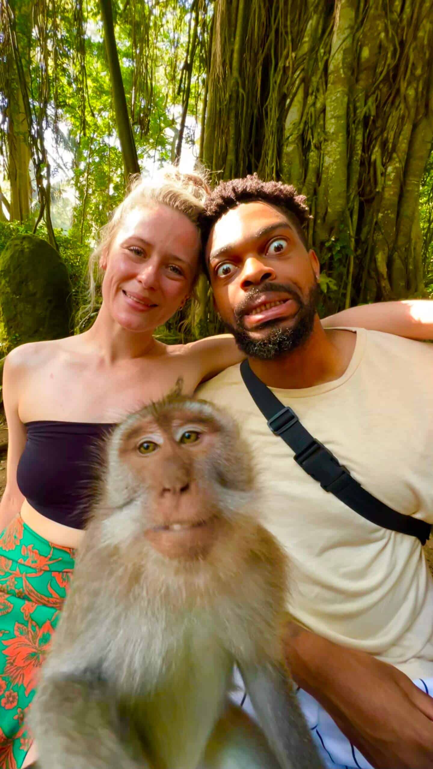 Beth and Denz with a monkey in the Monkey forest Bali. Part of a Travel blog and travel blog showing the best things to do around the world.