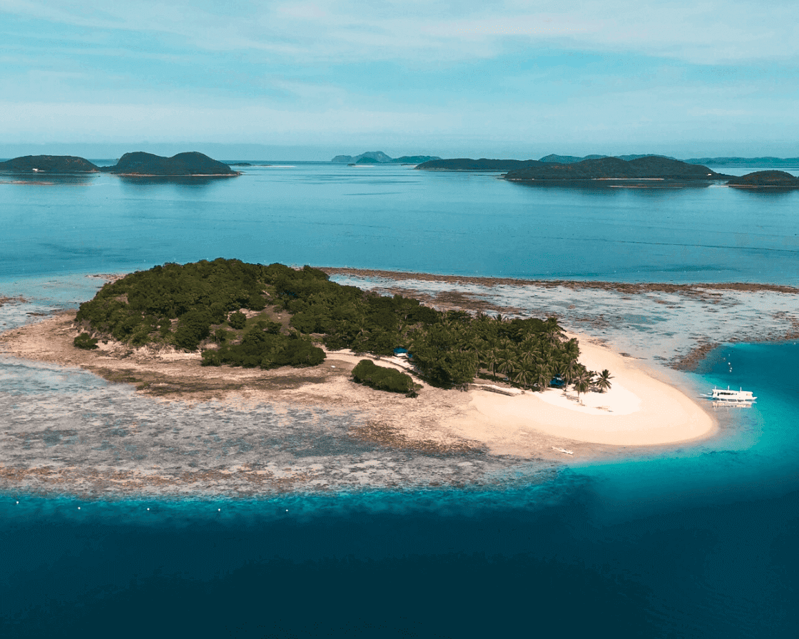 Pass Island, Coron, Philippines. A drone picture of Pass Island. Part of a travel guide and travel blog on what to do in the Philippines.