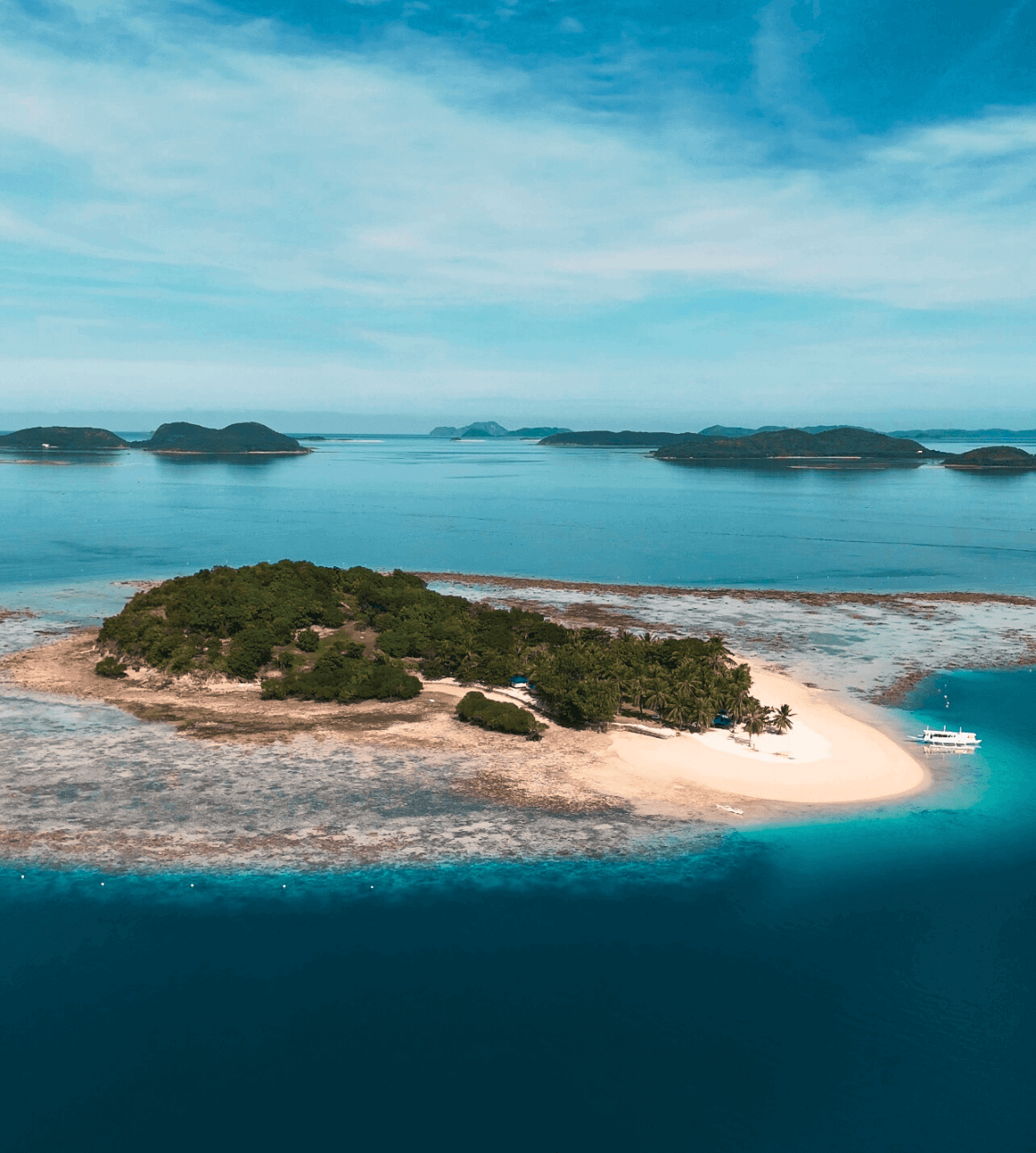 Pass Island, Coron, Philippines. A drone picture of Pass Island. Part of a travel guide and travel blog on what to do in the Philippines.