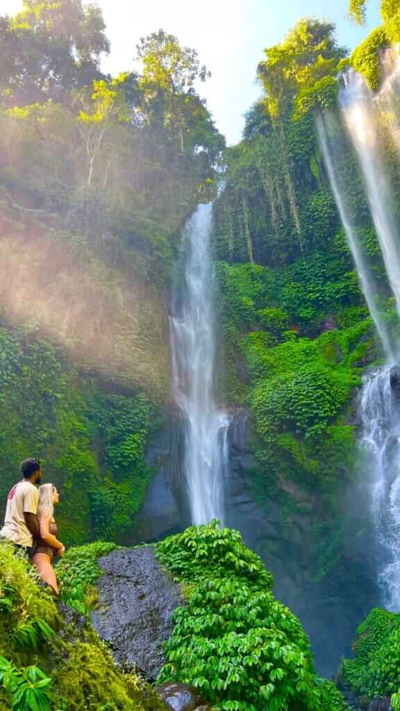 Beth and Denz at Sekumpul Waterfall in Bali. Part of a Travel blog and travel blog showing the best things to do around the world.