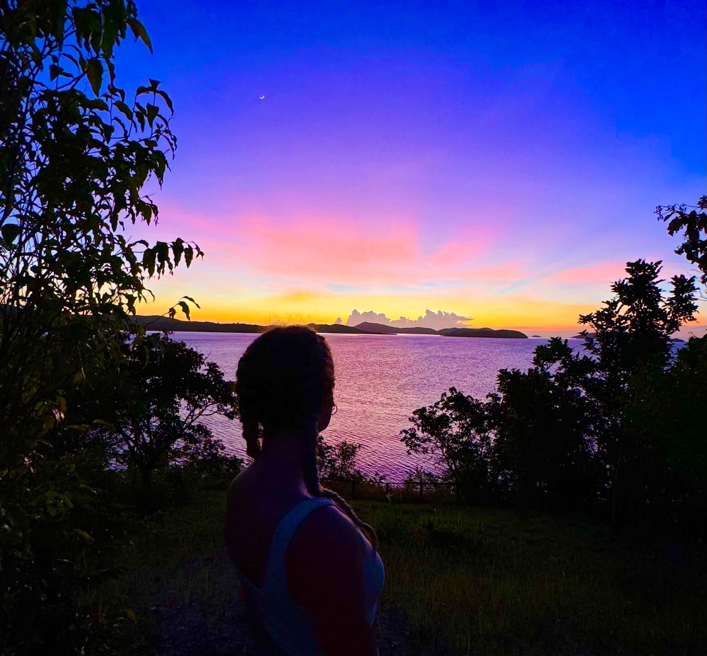 A picture of the sunset on Pass Island, Coron, Philippines. Part of a travel guide and travel blog on what to do in the Philippines.