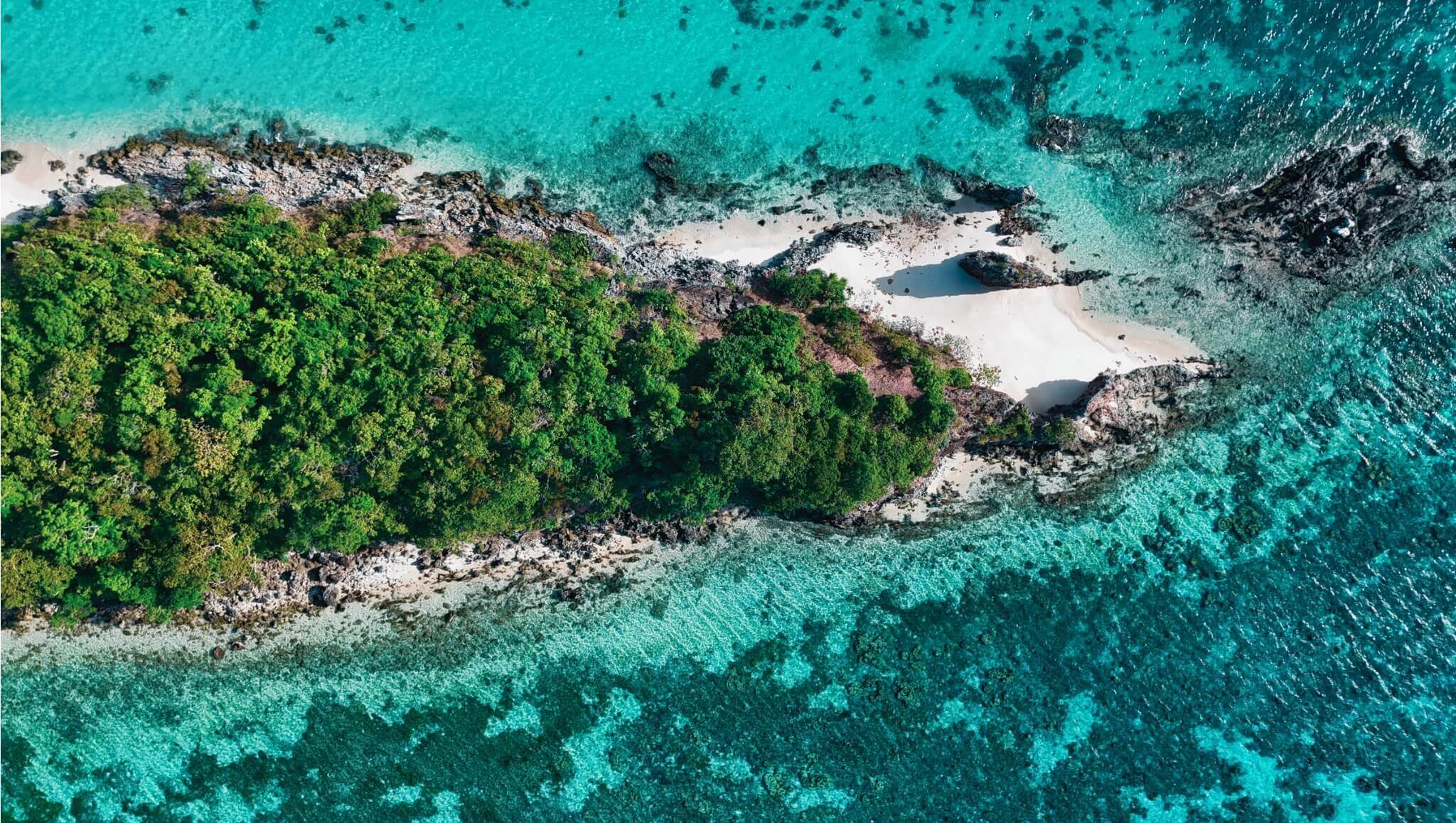 Drone Picture of Malcapuya Island In the Philippines. Part of a travel blog which has Travel guides and shows all the best things to do in the Philippines