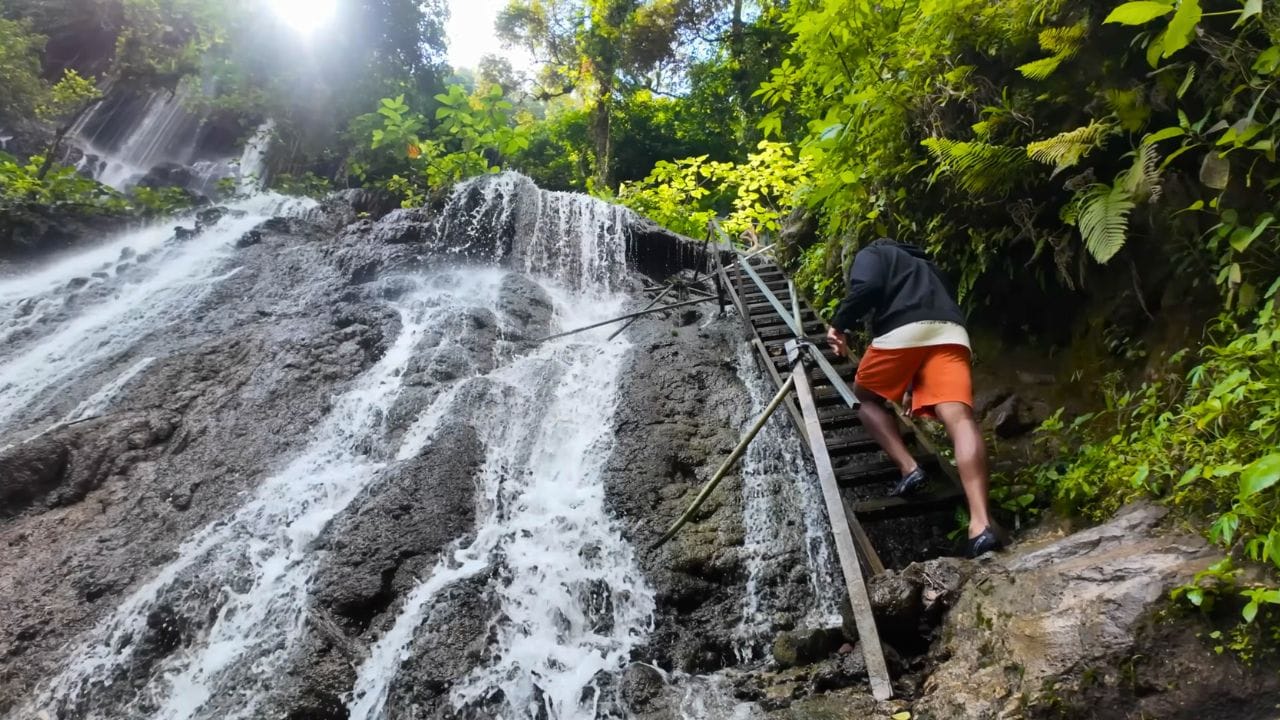 Stairs through waterfall Tumpak Sewu